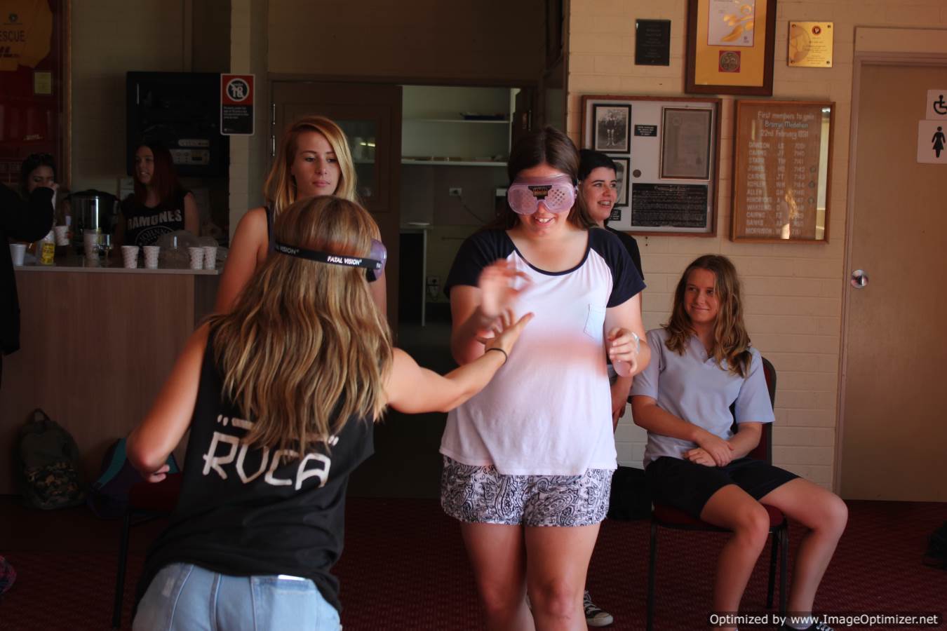 Students using the drunk goggles